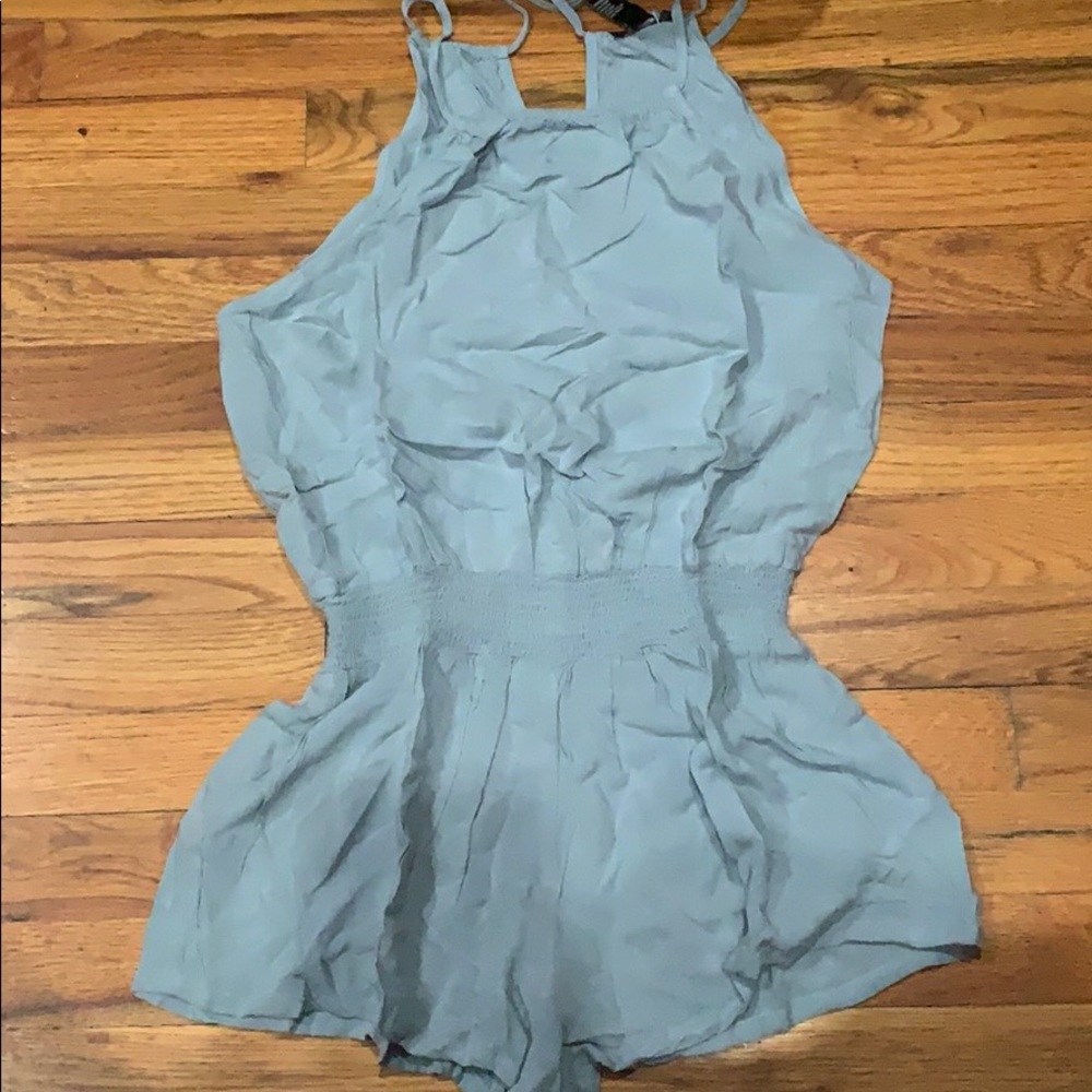 Light blue romper with pockets on the side